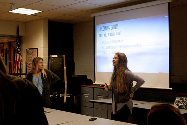 Presenting to club members, Sophie Hensley and Chloe McKerr discuss upcoming yoga related events.  Club Younity strives to bring spiritual awareness to the South student body.