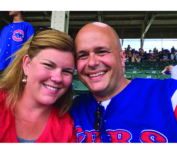 Smiling at the camera, GBS teachers Steve and Kara Bolf attend a Chicago Cubs game. There are several teachers who are married to their coworkers at South. Photo courtesy of Steve Bolf