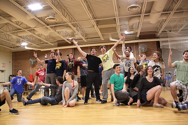 Friends   of   the   fiddler:  Cheering in a scene of Fiddler on the Roof, GBS and GBN students rehearse for the spring musical in the dance room. Fiddler on the Roof tells the story of Tevye, a milkman, whose spirit, pride and faith helps him get through the oppressive czarist Russia. Fiddler on the Roof will be showing in the Auditorium from April 26-29.