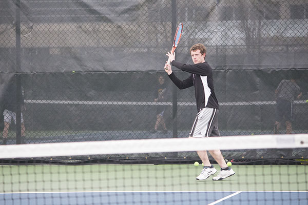 Facing his doubles partner,                                 captain Sebastian DesRoberts                               works on his forehand. DesRoberts and Gupta hope to do well at State.  