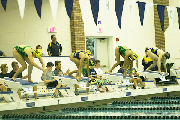 MIGHTY MARKS:  Taking their marks, the girls swim team gets ready to dive into the pool against GBN on Sept. 16. The Titans defeated the Spartans by a score of 123-63. 
