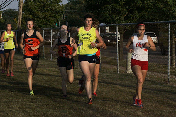 Running towards the finish line, Senior Megan Kennedy finished a cross country meet.