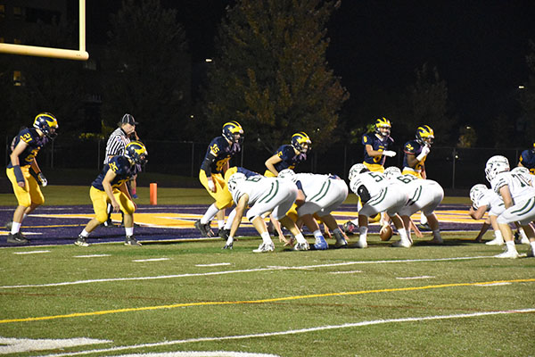 Turnaround Titans:  The Glenbrook South football team lines up for a play during their final regular season game against New Trier. The Titans fell to the Trevians 28-15, and went on to finish their season the following week against Barrington.