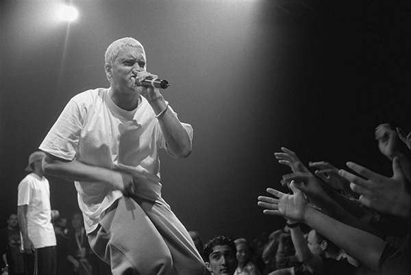EMPHATIC EMINEM:  Hyping up his fans, Eminem performs at his 1999 tour in Munich, Germany. Eminem was a best-selling artist in the 2000s and recently released his newest album, Revival. 