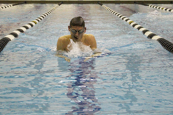 Coming up to take a breath, senior Nick Shectman competed against Highland Park on Feb 3. The meet was the Titan’s senior night, where the team honored the graduating senior class. 