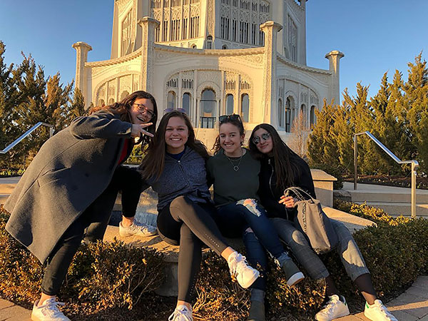 FRIENDLY FRENCHIES: Smiling with their French exchange partners, juniors Megan Stettler (second from left) and Taylor Everson (second from right) visit the Baha’i Temple in Wilmette. GBS students will travel overseas to France and Germany this summer to live with exchange partners. Photos courtesy of Megan Stettler