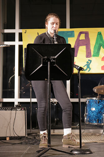 KIRBY IS KILLING IT: Standing on the stage at Jamnesty, Senior Erin Kirby plays her clarinet. Kirby also taught herself how to play the alto saxophone her freshman year.