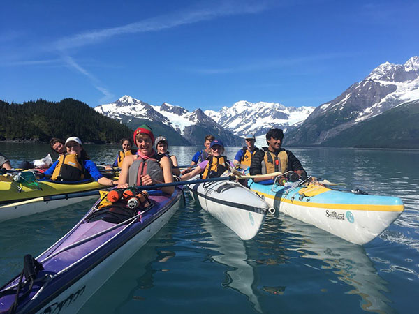 Cool Kayaking:   Kayaking through the Prince William Sound, Junior Ellie Ruos (second from the right) navigates the waters with her friends. Ruos went on a backpacking trip throughout the Alaskan wilderness, with nothing but the untouched world ahead of her. Photo courtesy of Wilderness Adventures