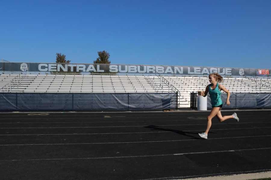 Senior captain Lila Frick practices on the GBS track. The girls cross country team finished third at the Wakanda meet on Sept. 1.