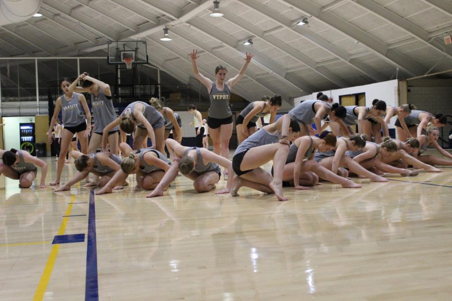 In their ending pose, the varsity Poms team practices their jazz dance routine preparing for their upcoming local competitions as well as National competition in Orlando, Florida.