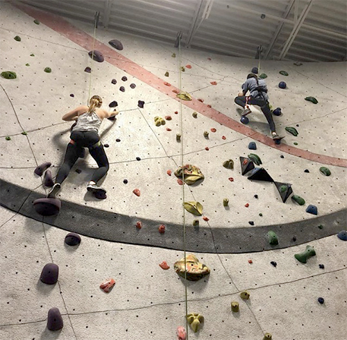 A   Climb   towards   success:  Climbing up and over the challenging walls, Outdoors Club enjoys one of their trips to the Vertical Endeavors climbing facility. Activities that the Outdoors Club members partake in, specifically rock climbing, are a great way for students to improve on their physical strengths, according to sophomore Harrison Wollney. 