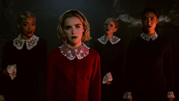 Actress Kiernan Shipka portrays timeless character Sabrina Spellman in Netflix’s chilling reboot of the comic strip and sitcom Sabrina the Teenage Witch. From left to right, actresses Tati Gabrielle, Abigail Cowen and Adeline Rudolph play the antagonistic, Macbeth-esque Weird Sisters in the show, which has been renewed for a second season.  