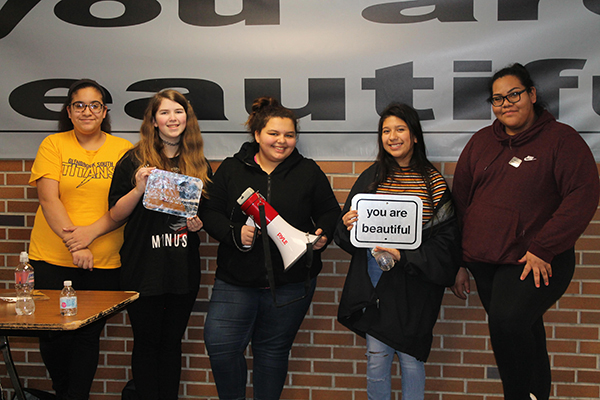 Beautifully built :  Beaming with smiles, (left to right) freshmen Nermeen Abdelgaward, Mya Wagner, sophomore Alina Bergquist, junior Jazmin Montesinos and senior Jenny Vargas advocate for South students to participate in their campaign during lunch blocks. The ‘You Are Beautiful’ campaign was brought to South by the club Images with the help of SAFE.