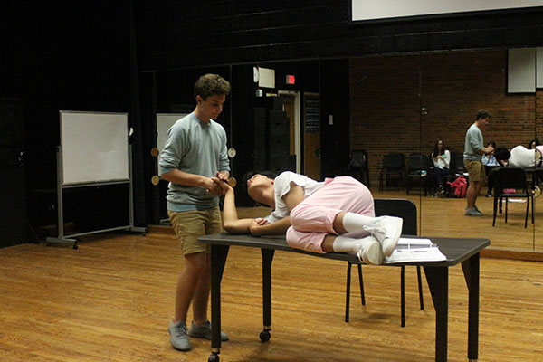passionate Performance:  Rehearsing for the highly-anticipied fall musical, Gavin Leahy (left) and Justin Manalang (right) practice everyday after school for the show’s opening on October 24. Photo by Dany Herrera