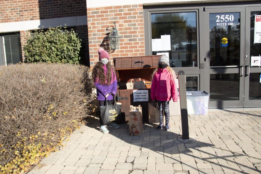 Helping Hands: Dropping off donations, members of the Glenview community show support for South’s canned food drive. All items can be dropped off at the front entrance of the school.