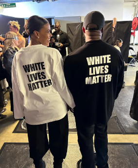 Controversy strikes! Kanye West, right, and Candace Owens, left, present their White Lives Matter shirts at the Paris fashion show. Photo courtesy of Page Six Style.