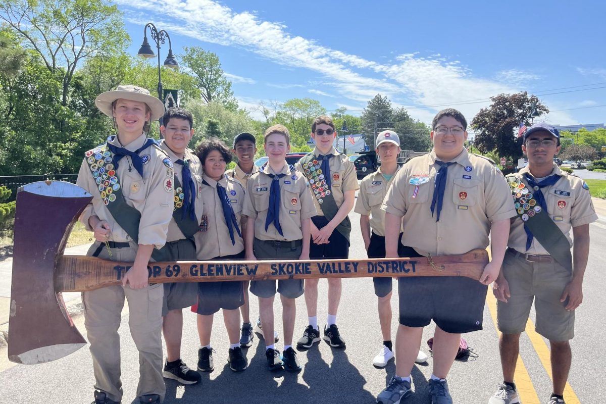 Soaring Scouts:  Eagle Scout Ethan Pollack (fifth from the left) and his troop walk at the Glenviews Memorial Day Parade in 2023, representing and supporting their community. Troop 69 marches in the parade every year with the local American legion point.