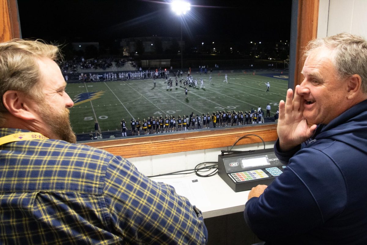 Bird Eye View:  Math Teacher Joe Karlovsky (left) and English Teacher Phillip Ralston (right) sit inside the box during the South Varsity Football game versus Lake Zurich while commenting live on the game.