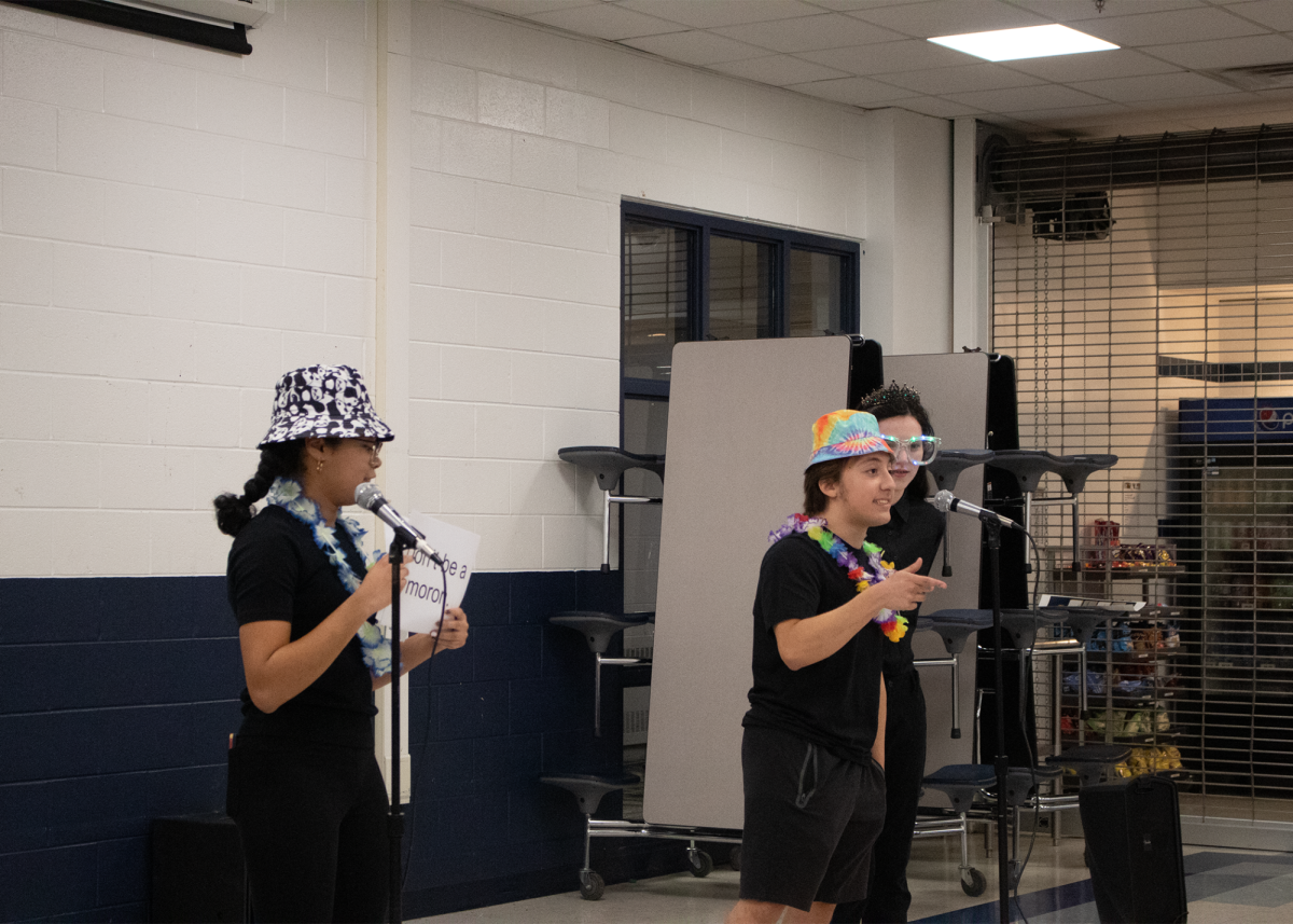 Show Time: Senior Mia Herman (left), senior Alek Troncoso (middle), and sophomore Elena Ross (right) are featured above in one of the many performances in Improvaganza! Actors are able to dress up in costume, while also performing prepared pieces in front of an audience. Photo by Leela Shah 