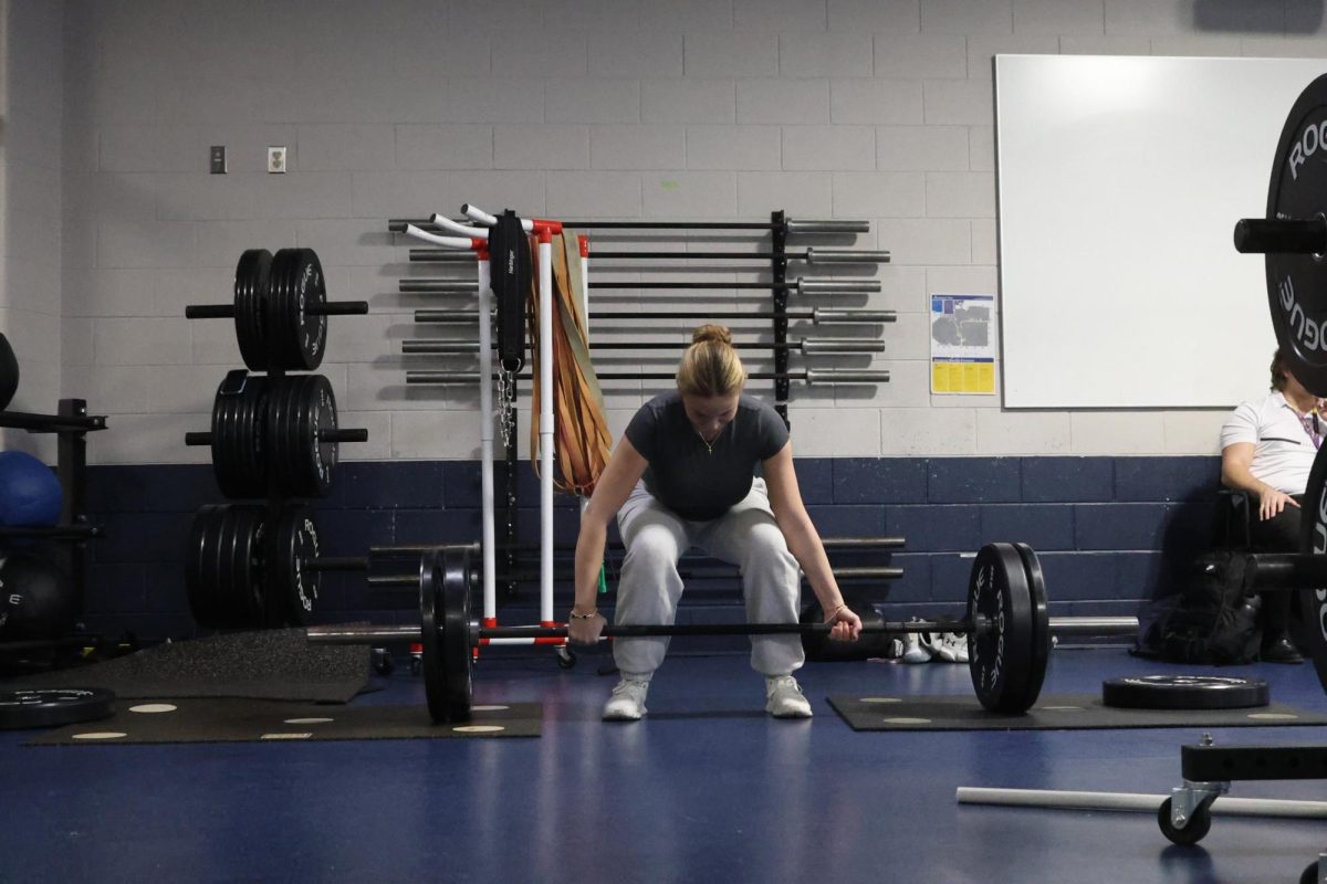 DYING TO DEADLIFT: Senior Rylie Kalinsky deadlifts in the weights room after school. As a participant of the Powerlifting Club, Kalinsky and others meet on Mondays and Wednesdays.
