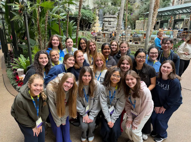 Winning Smiles: The Oracle Editorial Board poses for a photo at the Gaylord Opryland resort. The conference took place at the resort's convention center.