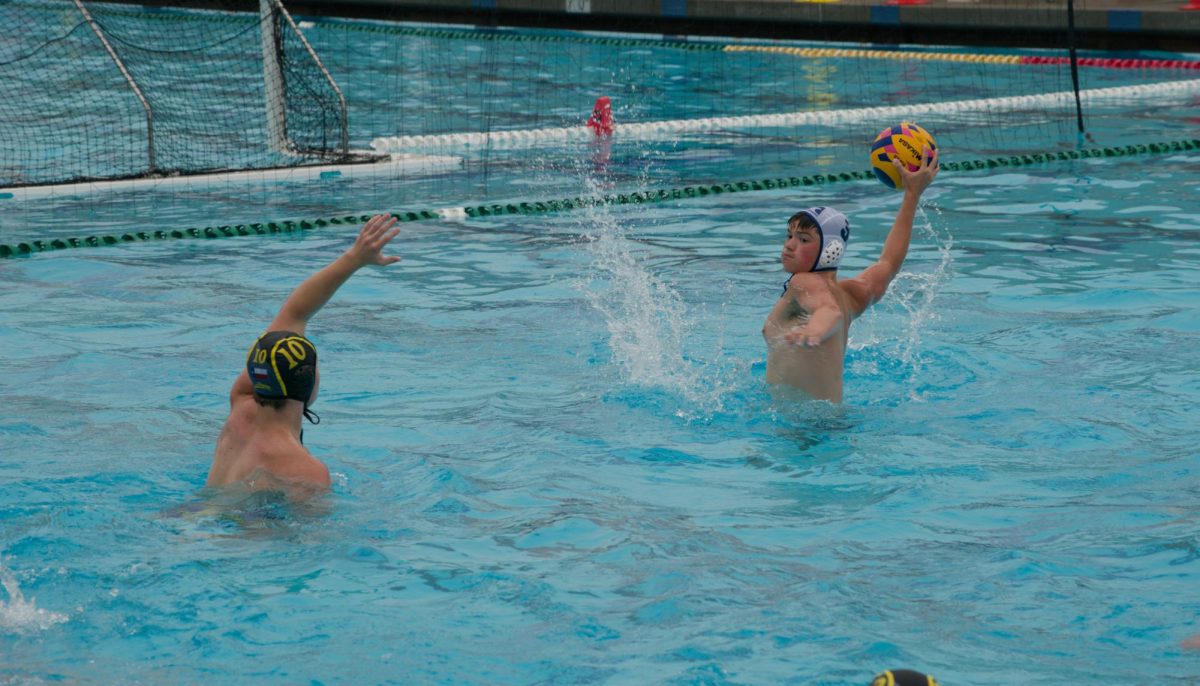 BOSCH MAKES A SPLASH: At the USA Water Polo National Junior Olym-
pics, Carter Bosch shoots the ball at the goal on July 20, 2025. This is the largest national water polo tournament in the USA and took place at Portola High School in Irvine California.