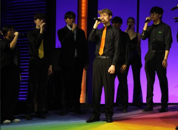 SENSATIONAL SINGING: Senior Jack Rahija opens Fusion’s, a pop acapella group, V-Show act, “Spectrum,” with a harmonious solo. The original song is by Florence and the Machine, although Fusion’s rendition was based on the Nor’easter’s performance, Northeastern University’s acapella group.