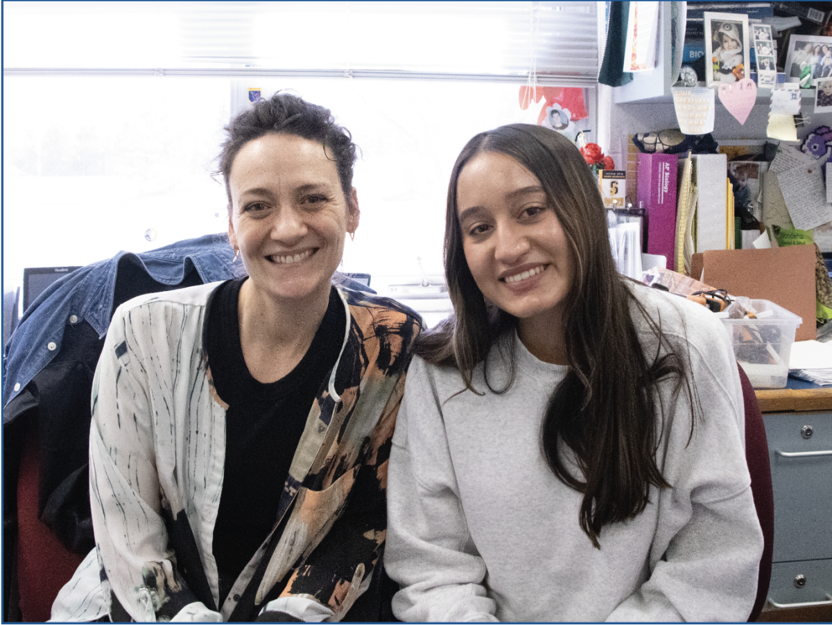 RESEARCH IN PROGRESS: Science Teacher Lindsey Reiser (left) and Zenia Babool (right) reviewed Babool’s presentation on stress and skin. Reiser gave tips on using notecards and preparing throughly.