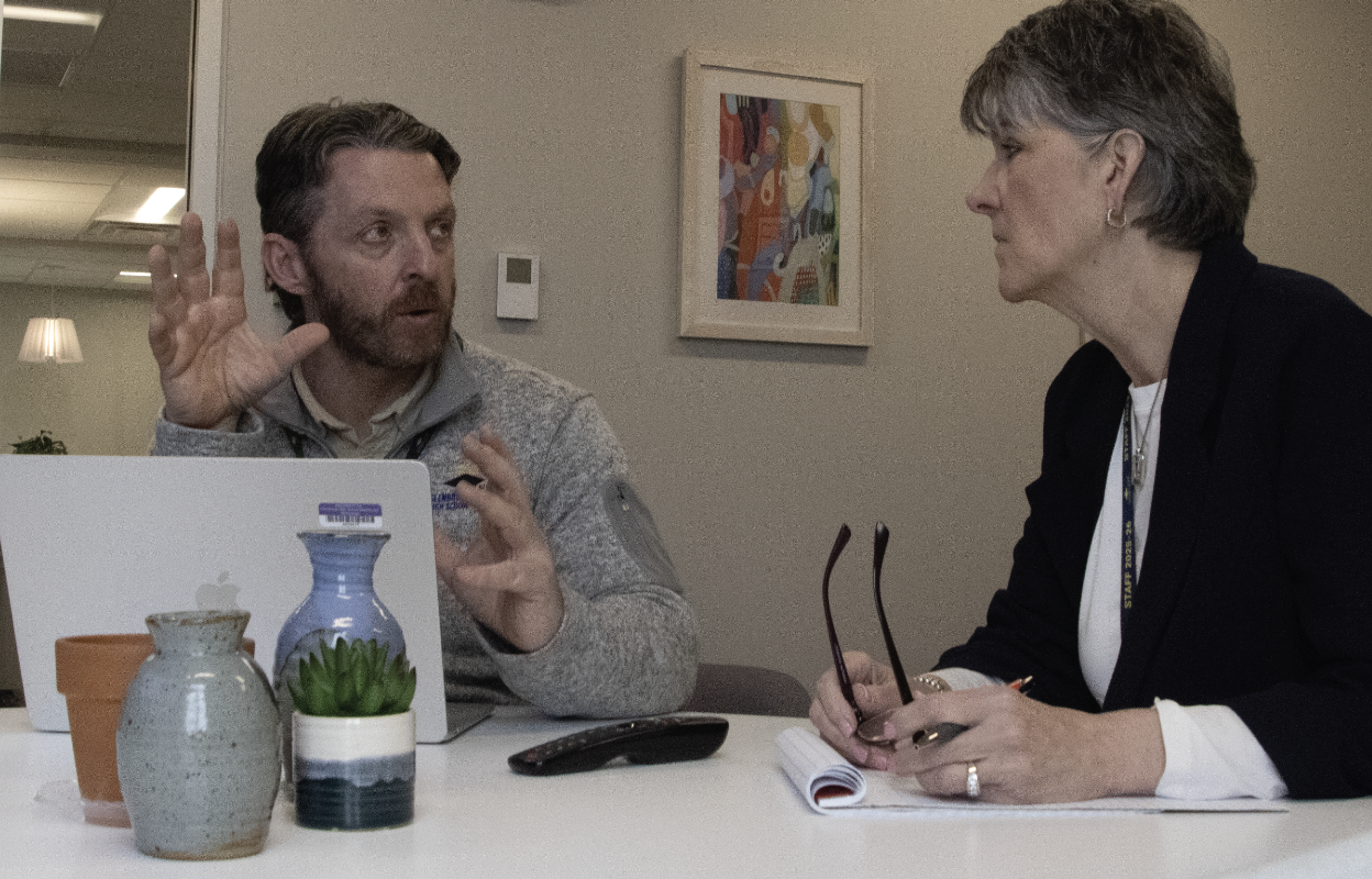 PLANNING FOR PROGRESS: Ryan Bretag, Assistant Superintendent of Teaching and Learning (left), and Carol Smith, Executive Director of Communications (right), met on April 10 in the District Office to discuss the 2024-29 Strategic Plan and how D225 board policy aligns to the plan. Goals included discussing leadership development as well as figuring out when updates would be presented to the D225 board of education.