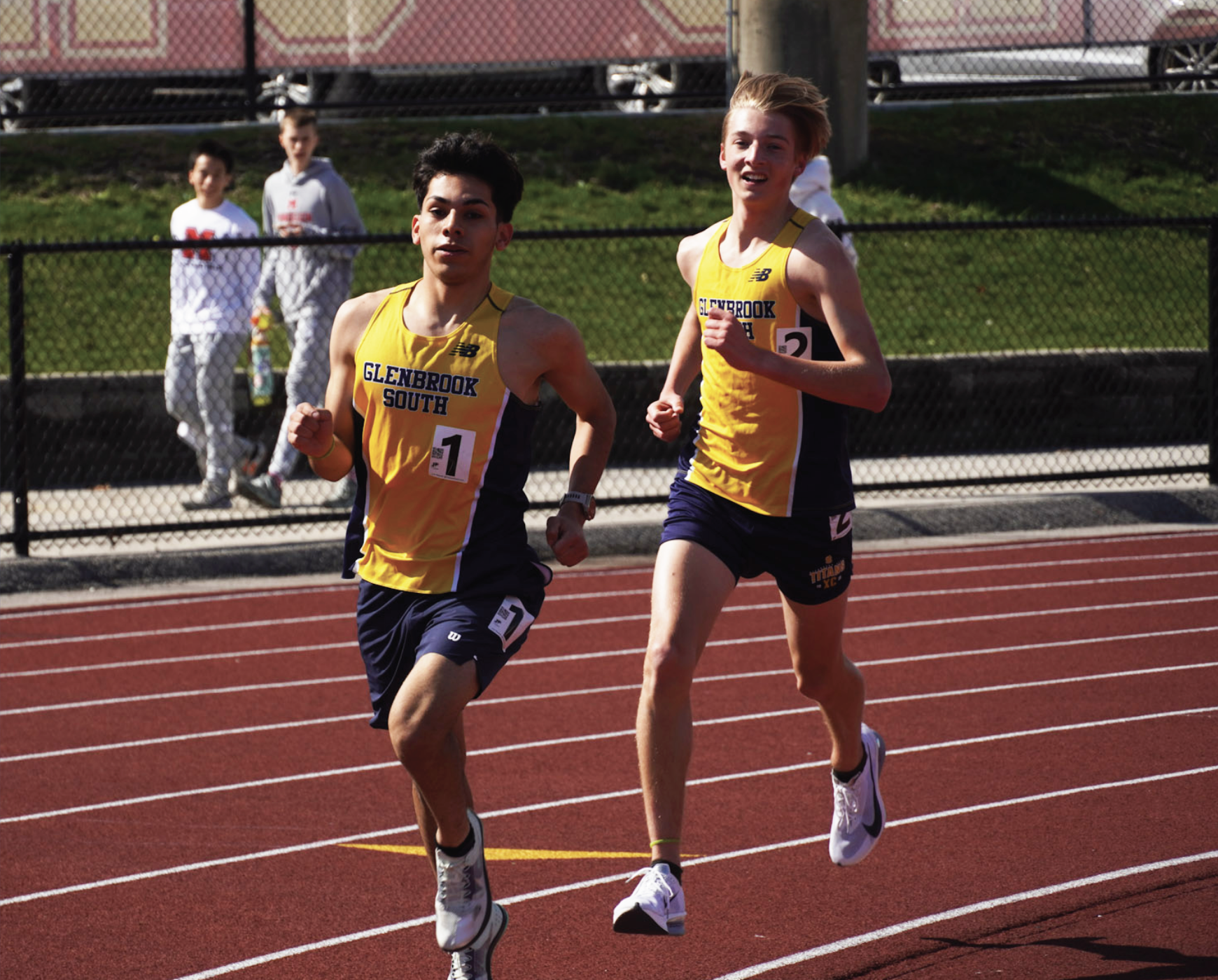 MOMENTS BEFORE MILESTONE: Senior Junior Lopez (left) and junior Frankie Hackl (right) ran at the Schaumburg Mikias Tibebu Invite on April 25. They were photographed moments before Hackl overtook Lopez for the new record. 