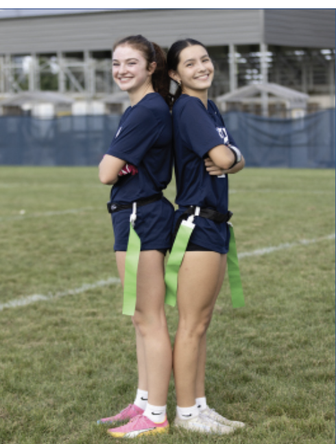 FUTURE OF FLAG: Freshmen June Floyd (left) and Tia Wang (right) are on the field during preparations for their match against Carmel Catholic High School on Aug. 28. Both bring experience and energy to the team as newcomers this season. 