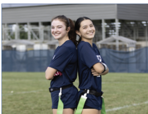 FUTURE OF FLAG: Freshmen June Floyd (left) and Tia Wang (right) are on the field during preparations for their match against Carmel Catholic High School on Aug. 28. Both bring experience and energy to the team as newcomers this season. 