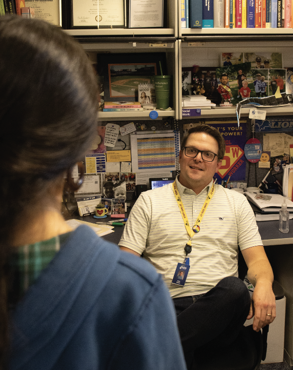 SOCIAL SUPPORT: Social Worker Alan  Esser talks with a student about the various resources at South. Student are welcome to come down to Student Services at any time, he said. 