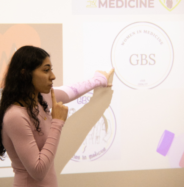 WOMEN EMPOWER HEALTHCARE: Junior Maryum Ahmed teaches about oncology for a Women In Medicine meeting. Members simulated finding a tumor in playdough within a limited amount of time.